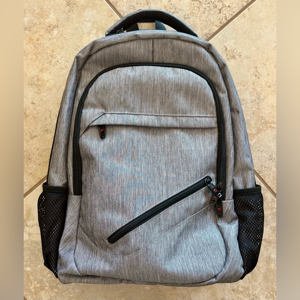 Backpack EXCELLENT condition! Lots of zip compartments. Grey black. CLEAN!